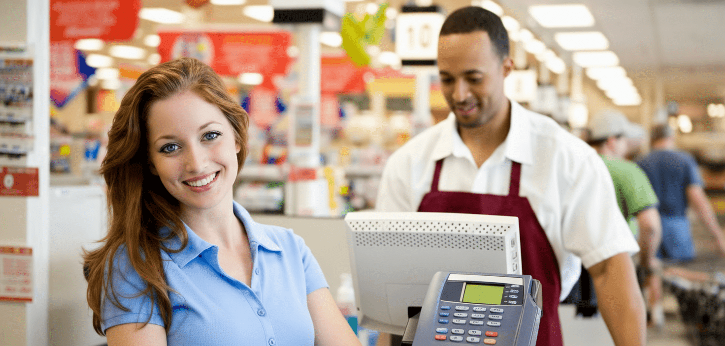 Girl and guy at checkout.